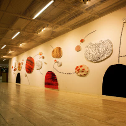 The wall of an art exhibition lit up.